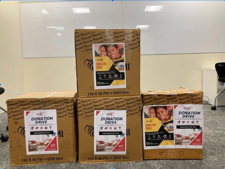 Donation drive boxes stacked in the Chain IQ office