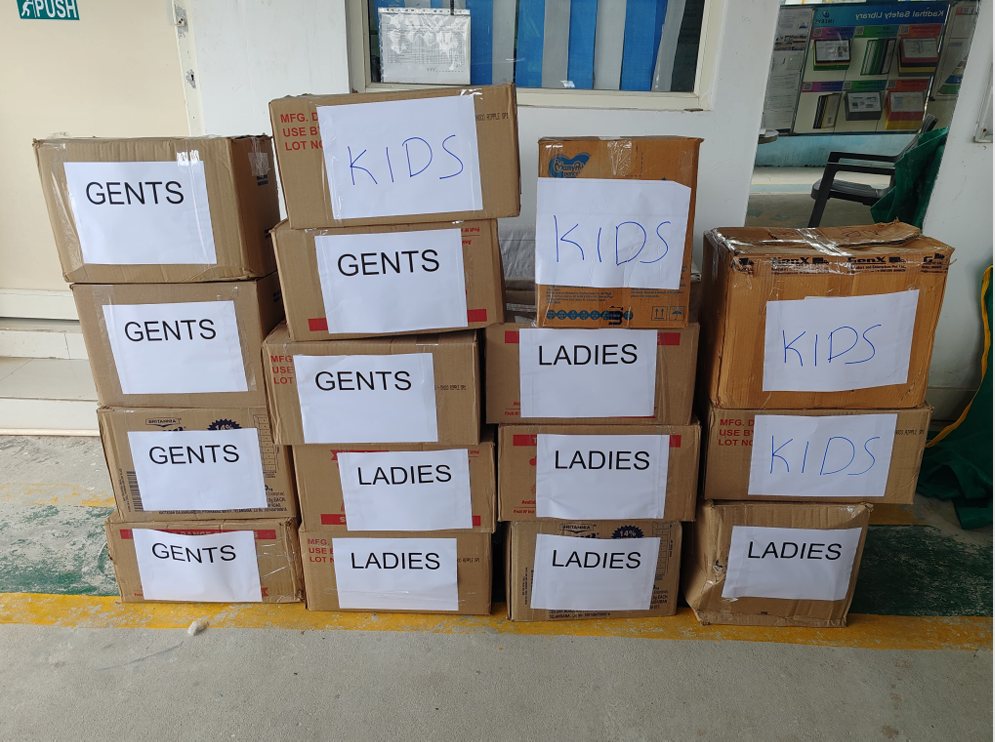 Stacked donation boxes labelled gents, ladies and kids at the Imerys drive