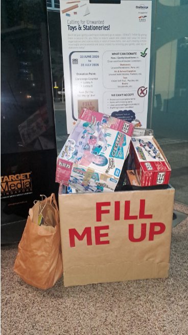 A donation bag overflowing with toys and stationery at One George Street